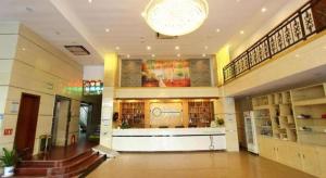 a large building with a library with a chandelier at Yi Mi Hotel Shenzhen Longgang Pinghu South China City in Tiantangwei