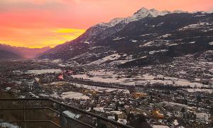 an aerial view of a city with a mountain at Atmosfera e vista mozzafiato Chalets in Aosta