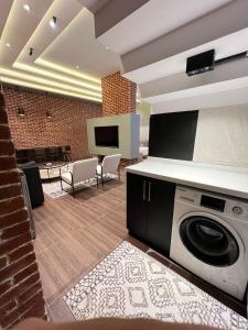 a living room with a washing machine in a room at luxury basement studio in Riyadh +6 photos