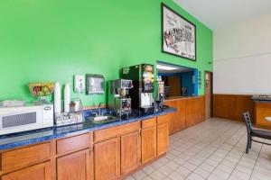 a waiting room with a counter in a restaurant at Super 8 By Wyndham Wayne in Wayne