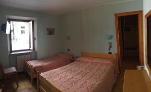 Postel nebo postele na pokoji v ubytování Albergo Ristorante Sole