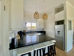 Kuchyň nebo kuchyňský kout v ubytování 220 Big Bay Beach Club + 8 fotografií