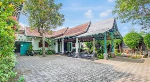 Κήπος έξω από το Capital O 93938 Wisma Pamungkas Syariah