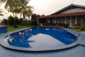 Bazén v ubytování Capital O 94094 New Lembah Nyiur nebo v jeho okolí