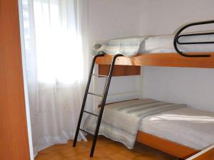 Postel nebo postele na pokoji v ubytování Nice villa in Porto Santa Margherita with garden + 30 fotografií