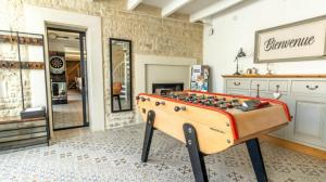 a store with a foosball table in a room at Domaine Ericarclem in Aigrefeuille-dʼAunis