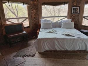 Postel nebo postele na pokoji v ubytování Elephant Memories