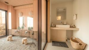 a bathroom with a sink and a mirror at 來Lai 北軽井沢Resort Villa 158 in Tsumagoi +149 photos