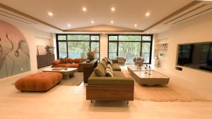 a large living room with couches and a tv at 來Lai 北軽井沢Resort Villa 158 in Tsumagoi