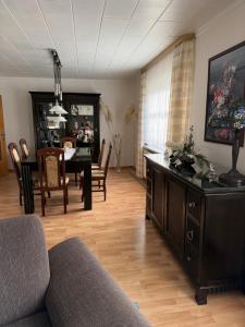 a living room with a table and a dining room at Ferienhaus in Grevesmühlen