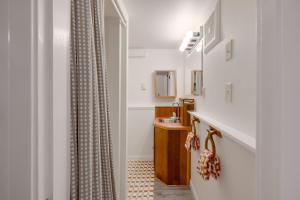 a bathroom with a sink and a shower curtain at The Three Bears MCA 901 in Manzanita +46 photos