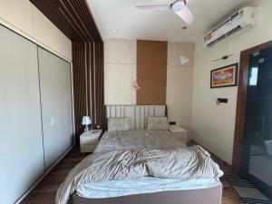 a bedroom with a large bed in a room at NTH Villa in Udaipur