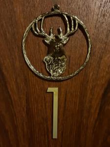 a number one with a deer head on a door at Hirschblick Apartments Willingen in Brilon