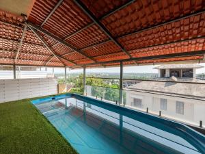 an indoor swimming pool on the roof of a building at Villa Vana by DanCenter in Arpora