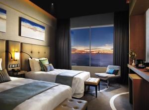 Ένα ή περισσότερα κρεβάτια σε δωμάτιο στο Genting Highlands Hig-end Room