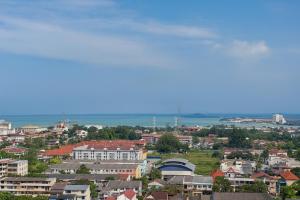 a view of a city with houses and the ocean at PD D'Wharf High Floor Studio With Private Entrance And Seaview Balcony in Port Dickson