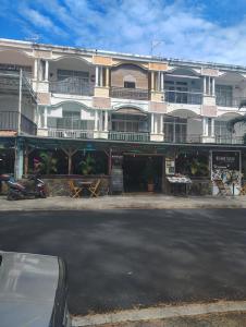 a large white building on the side of a street at Private Haven Escape in Pereybere +15 photos