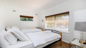 Ένα ή περισσότερα κρεβάτια σε δωμάτιο στο Point Vista Poingt Clare +7 φωτογραφίες