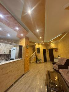 a living room with a couch and a table at Manand Hotel in Yerevan