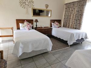 Ένα ή περισσότερα κρεβάτια σε δωμάτιο στο Steendal Guest House