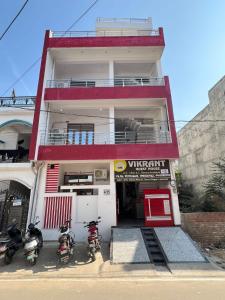 a building with three motorcycles parked in front of it at Hotel Vikrant Inn in Lucknow