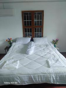 Postel nebo postele na pokoji v ubytování Roza Guest House