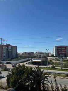 a view of a parking lot in a city at jawhara residency front view in Sousse