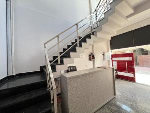 a staircase in a building with a stair case at Hotel Vikrant Inn in Lucknow