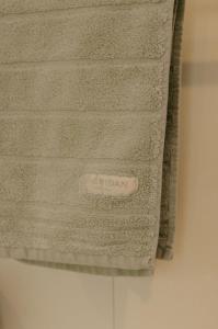 a towel hanging on a wall in a bathroom at The Waterfront Apartment in Port Fairy +50 photos