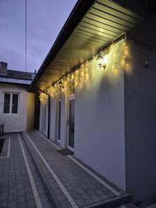 a row of lights on the side of a building at Exclusive Apartments "Lviv Vernygory 14", Modern Apartments with Self Check-in in Lviv