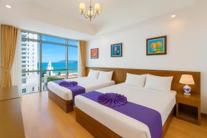 En eller flere senge i et værelse på Central Nha Trang Hotel & Business