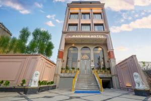 a building with a staircase in front of it at Hotel Marrion in Amritsar