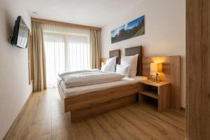 En eller flere senge i et værelse på Apart Viva Ischgl