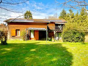 a house with a large yard in front of it at Gîte Soye in Eauze