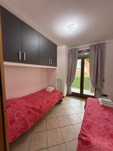 Ένα ή περισσότερα κρεβάτια σε δωμάτιο στο La Corte Sul Lago casa vacanze