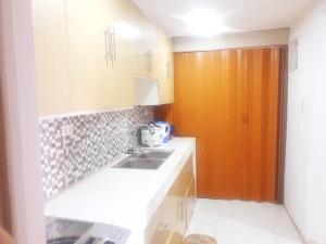 O bucătărie sau chicinetă la Fernica Boarding House