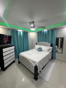 Ένα ή περισσότερα κρεβάτια σε δωμάτιο στο Estilo & Confort