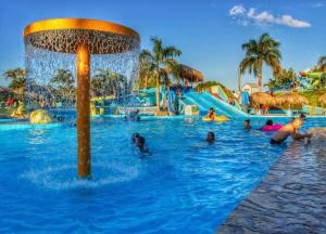 a group of people in the water at a water park at Estilo & Confort in Mendoza
