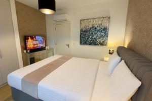 a hotel room with a bed and a television at Belgrade Waterfront Penthouse 17th last floor in Belgrade +54 photos