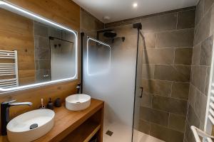 a bathroom with a sink and a shower at Chalet Prestige - Ski au pieds - Les Angles in Les Angles +28 photos