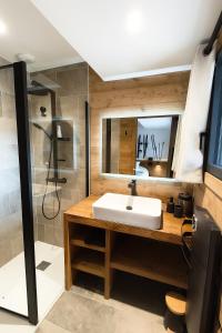 a bathroom with a sink and a shower at Chalet Prestige - Ski au pieds - Les Angles in Les Angles