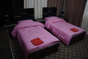 Postel nebo postele na pokoji v ubytování Petra sharing room