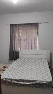 Postel nebo postele na pokoji v ubytování Enumo House