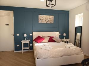 Ένα ή περισσότερα κρεβάτια σε δωμάτιο στο A Casa Di Ugo