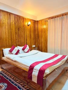 En eller flere senge i et værelse på Himali Homestay, Mirik