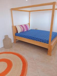 Ένα ή περισσότερα κρεβάτια σε δωμάτιο στο Residence wa maore