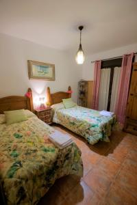 Postel nebo postele na pokoji v ubytování Vivienda Rural LA SOÑADA en El Bosque