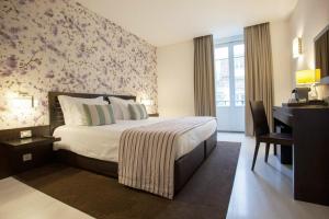 Katil atau katil-katil dalam bilik di Internacional Design Hotel