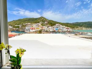a view from a window of a beach and buildings at Casa Francesco Seaside in Sant'Angelo D'Ischia