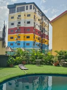 a building with colorful windows and a swimming pool at Soothing Haven2 in Ibadan